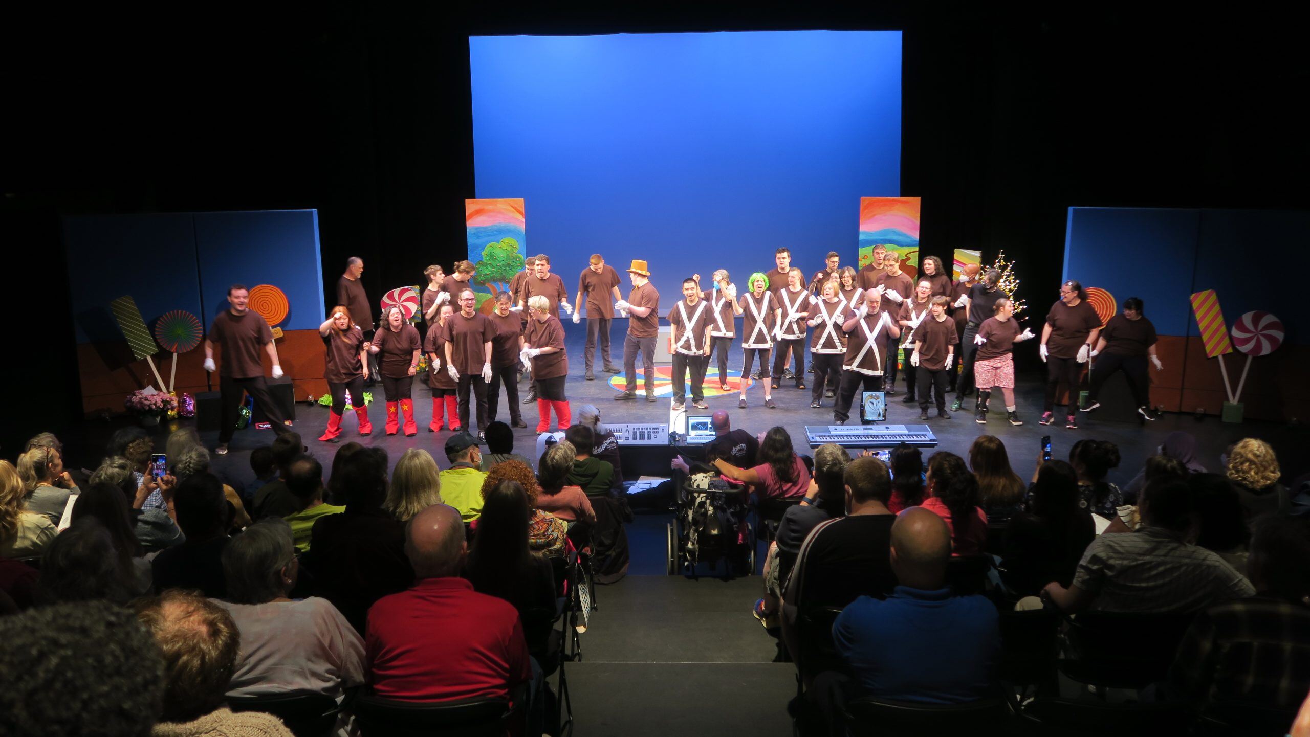 Whole Children and Milestone’s Theater Production is on stage performing their original play “Wonkavengers” in front of a live audience.