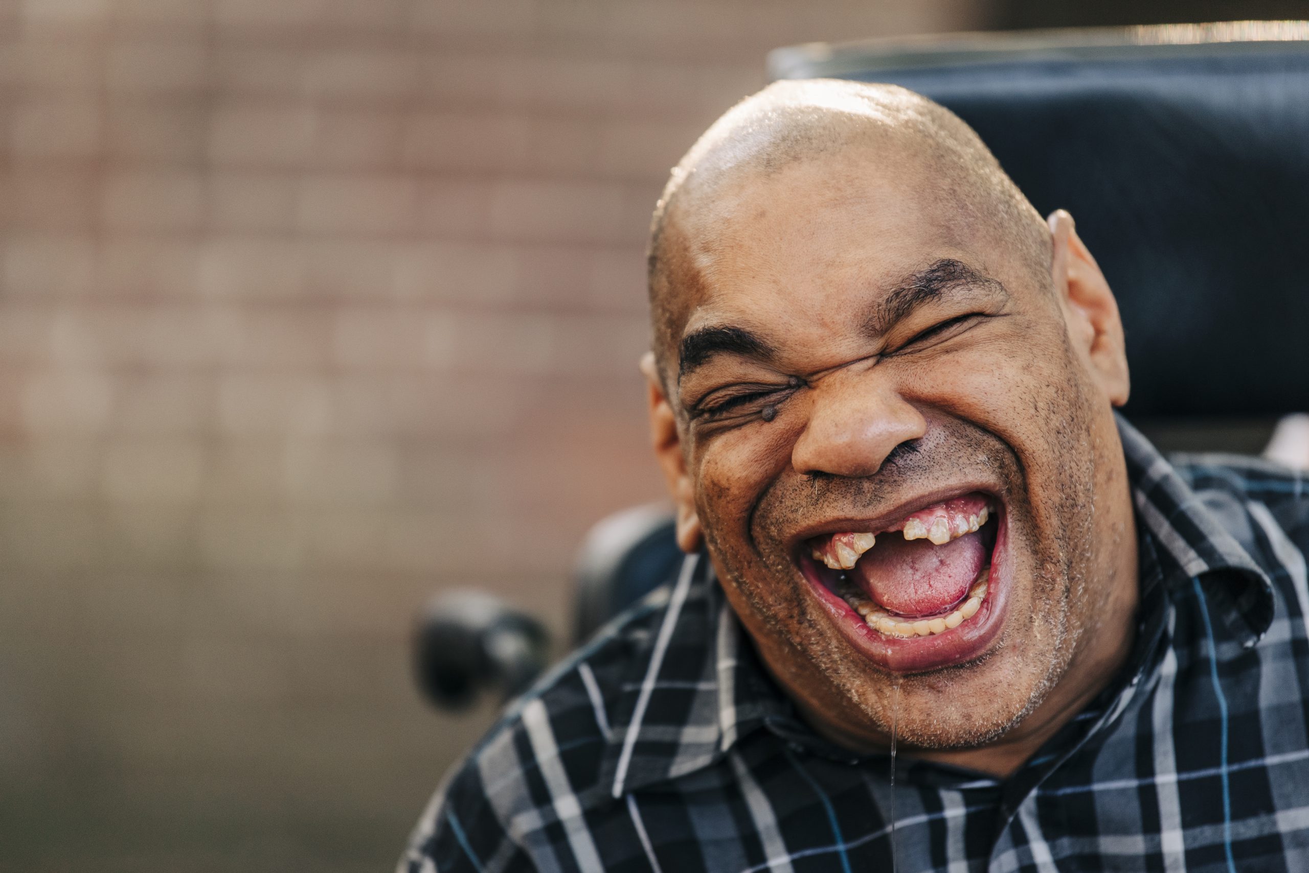 Man in wheelchair laughing